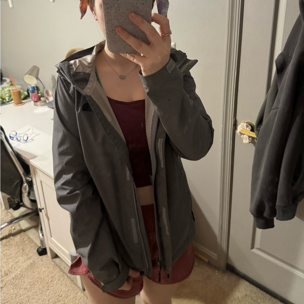 gray north face rain jacket